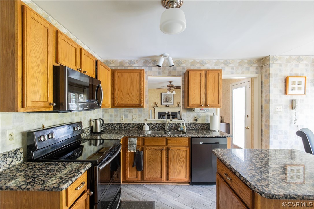 5169 Hackney Road North Chesterfield, VA 23234 - Photo 13 of 29 a kitchen with stainless steel appliances granite countertop a stove a sink and a microwave