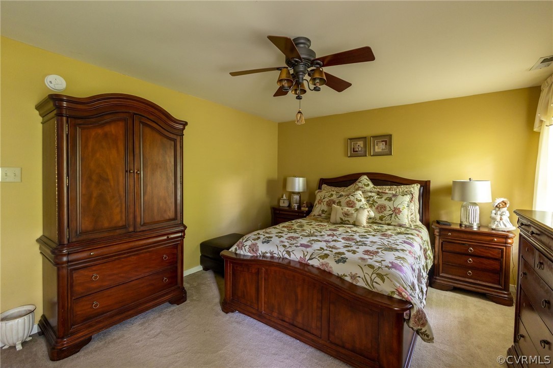 5169 Hackney Road North Chesterfield, VA 23234 - Photo 19 of 29 a bedroom with a bed and wooden floor