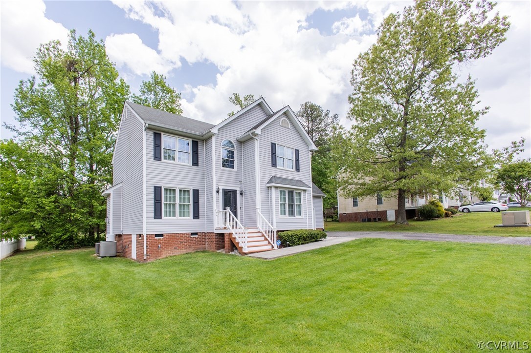5169 Hackney Road North Chesterfield, VA 23234 - Photo 3 of 29 a front view of a house with a garden and trees