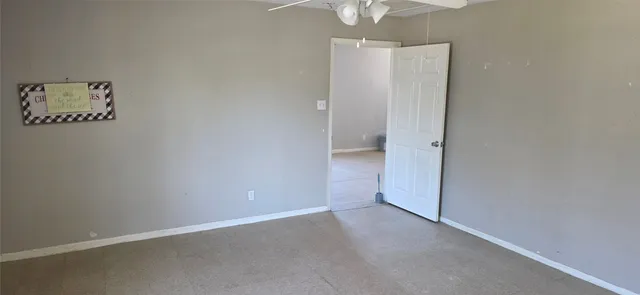 an empty room with a bathroom