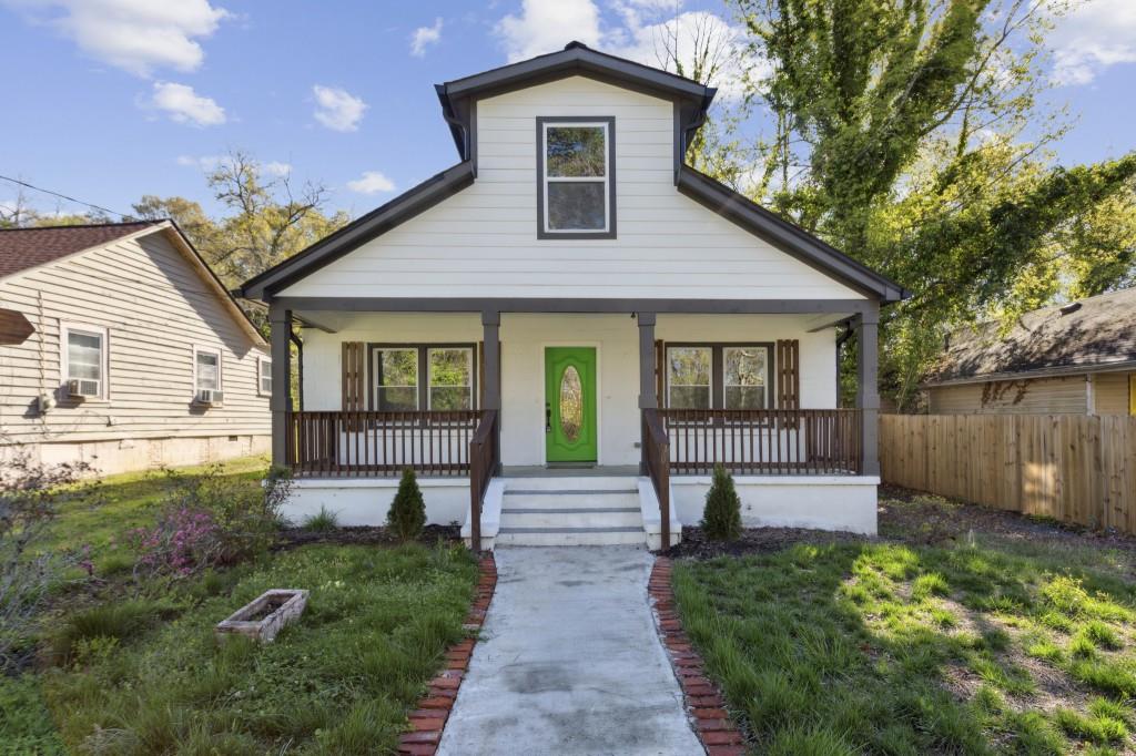 2316 Herring Road Southwest Atlanta, GA 30311 - Photo 1 of 1 a front view of a house with a yard