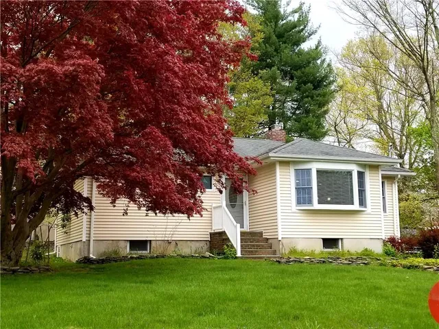 a front view of house with yard