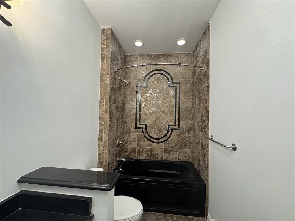 212 Chelsea Street, Unit 1 Boston, MA 02128 - Photo 13 of 24 a bathroom with a sink and a mirror