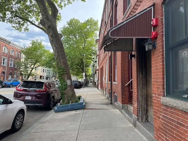 a view of a cars park in front of a house