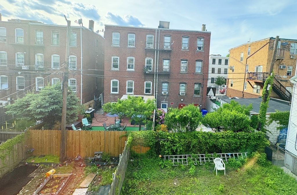 212 Chelsea Street, Unit 1 Boston, MA 02128 - Photo 19 of 24 a view of a back yard