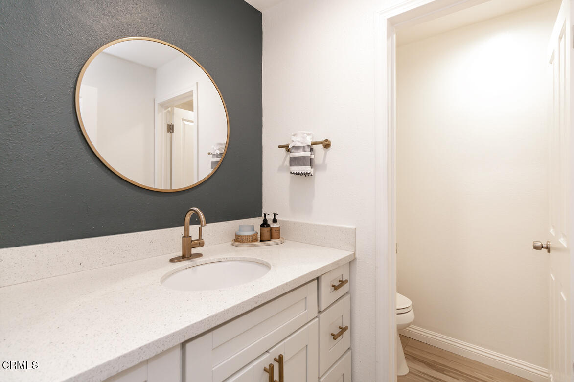 2940 North Verdugo Road, Unit 309 Glendale, CA 91208 - Photo 11 of 26 a bathroom with a sink and a mirror