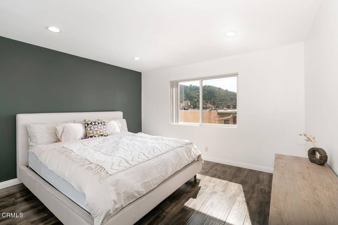 2940 North Verdugo Road, Unit 309 Glendale, CA 91208 - Photo 15 of 26 a bedroom with a bed and a window