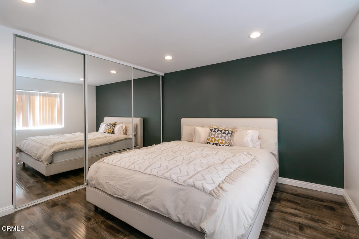 2940 North Verdugo Road, Unit 309 Glendale, CA 91208 - Photo 16 of 26 a bedroom with two beds and a night stand