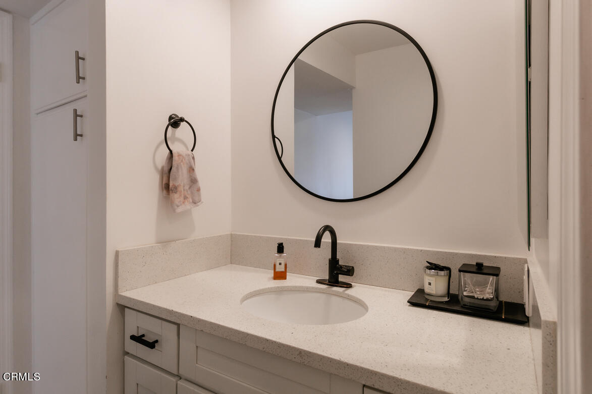 2940 North Verdugo Road, Unit 309 Glendale, CA 91208 - Photo 18 of 26 a bathroom with a sink and a mirror