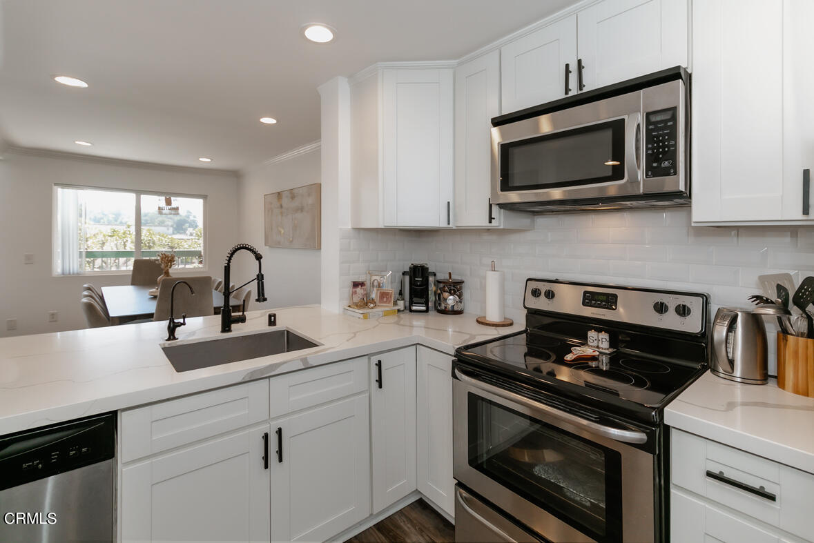 2940 North Verdugo Road, Unit 309 Glendale, CA 91208 - Photo 8 of 26 a kitchen with a sink stove and microwave