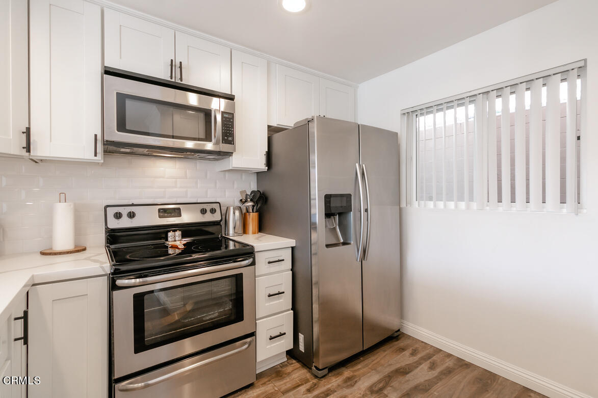 2940 North Verdugo Road, Unit 309 Glendale, CA 91208 - Photo 9 of 26 a kitchen with a refrigerator stove and microwave