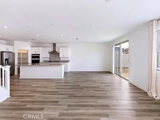 a view of kitchen with wooden floor