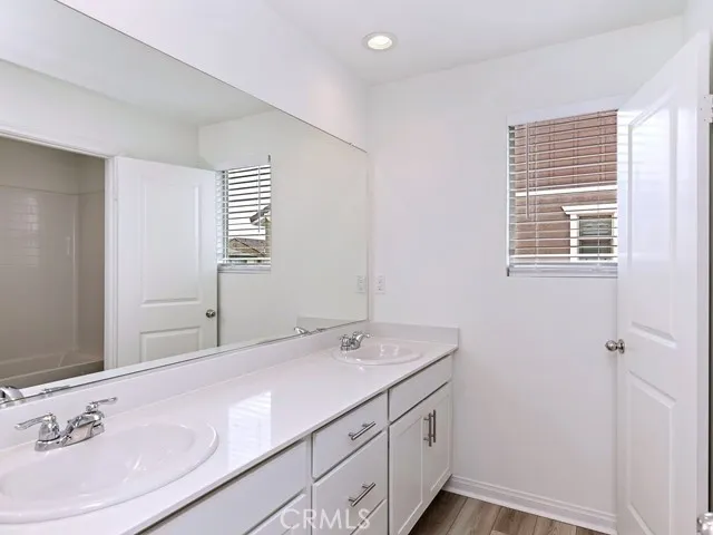 a bathroom with a sink a vanity and a mirror