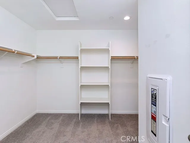 a bathroom with a sink a shower and a mirror