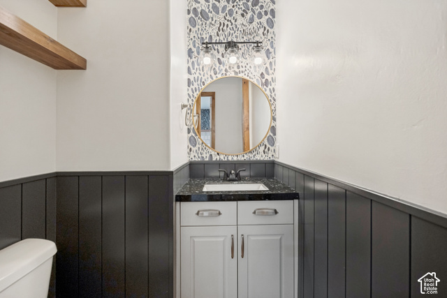259 Twin River Loop Alpine, UT 84004 - Photo 15 of 61 Vanity with integrated sink, dark speckled countertop, and light wood-finish cabinetry