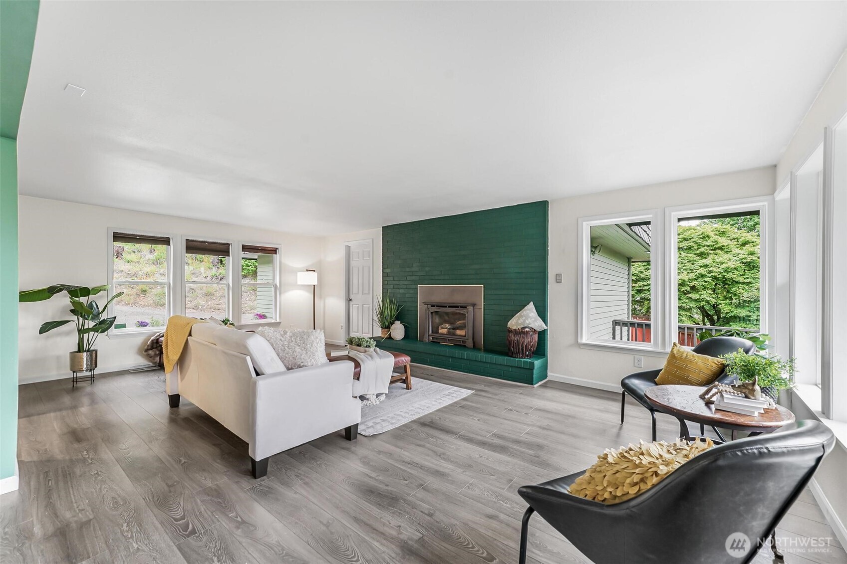 11404 Karshner Road East Edgewood, WA 98372 - Photo 7 of 40 a living room with furniture and a fireplace