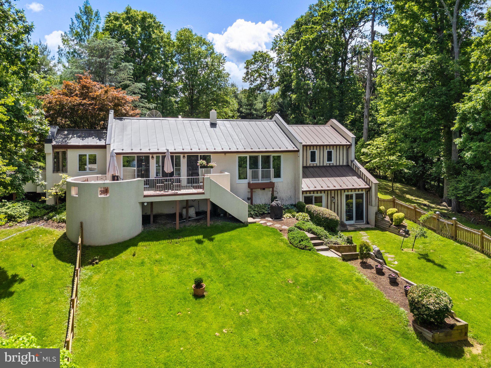 Side elevation of home with fenced in yard.