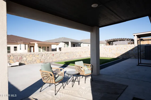 a balcony view with a seating space