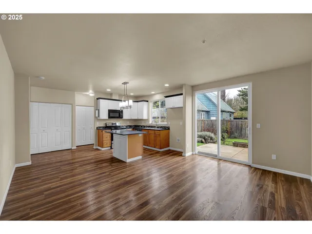 a view of kitchen with wooden floor