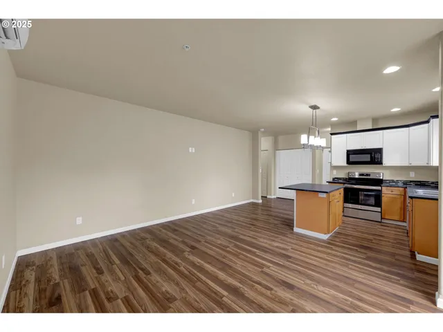 a view of kitchen with wooden floor