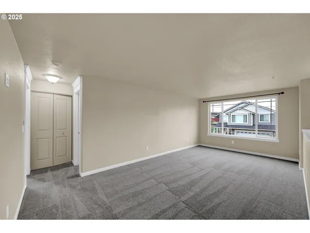 a view of an empty room and window