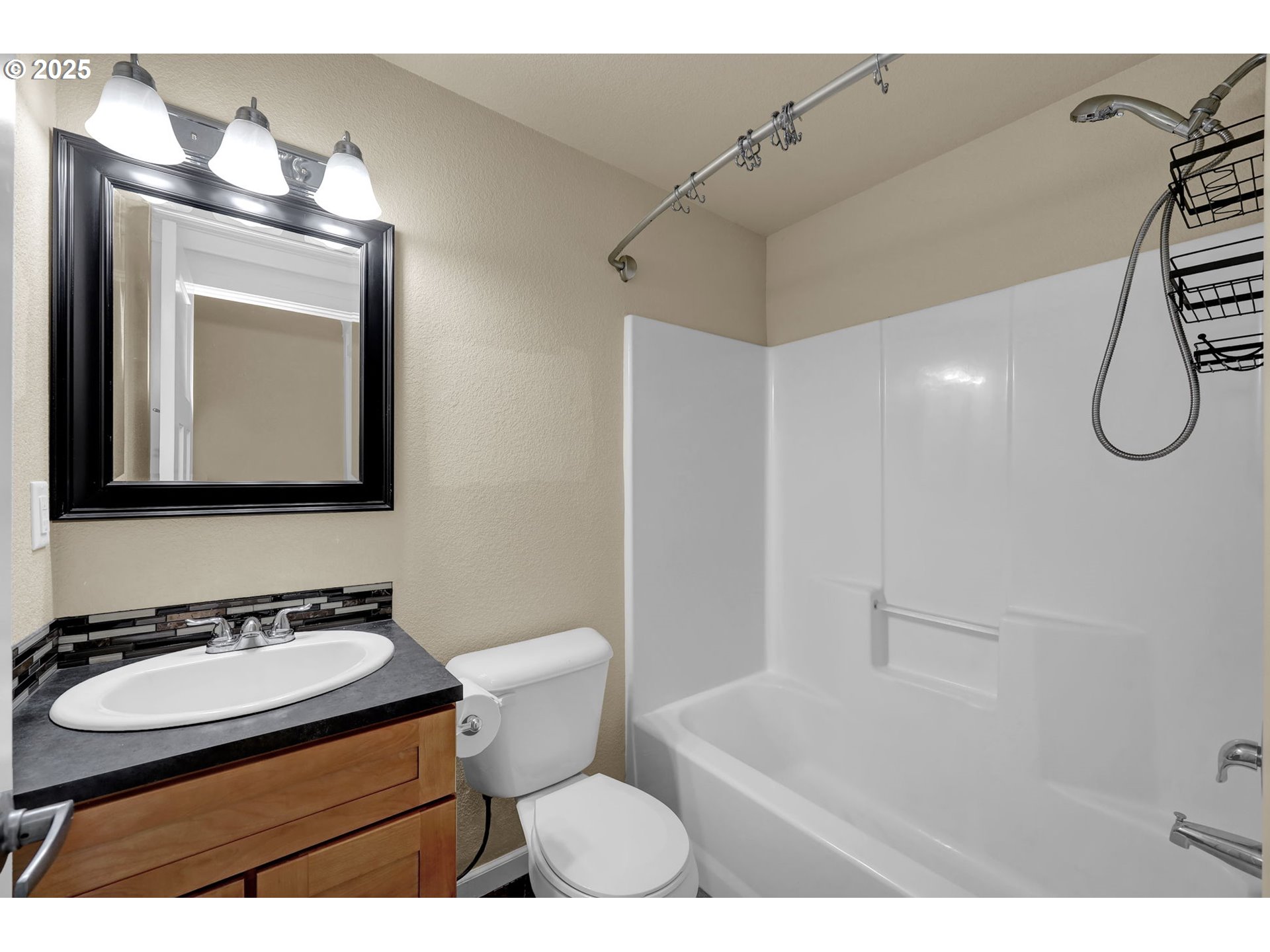 1725 Allea Drive Eugene, OR 97404 - Photo 24 of 44 a bathroom with a sink toilet a mirror and vanity