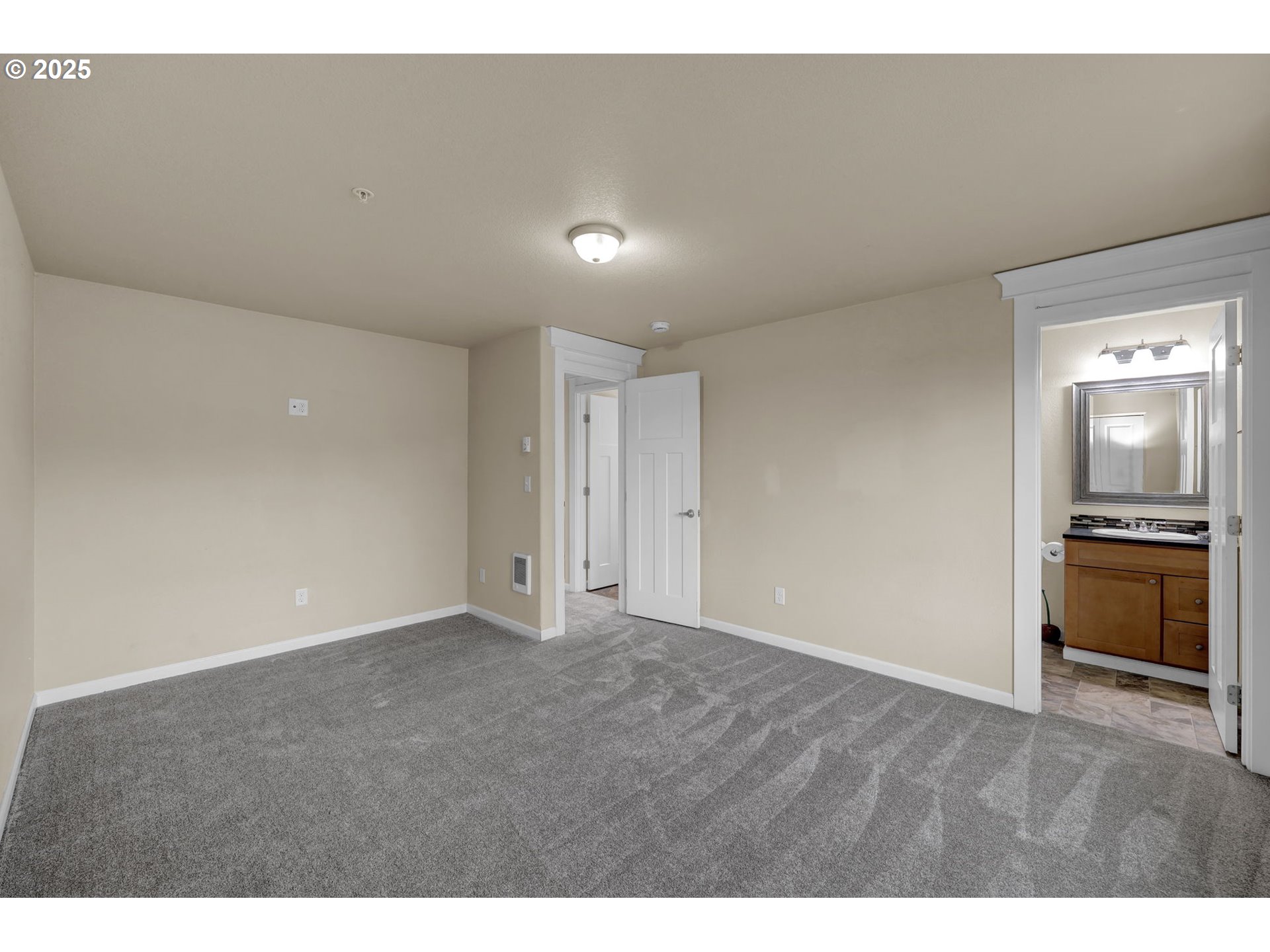 1725 Allea Drive Eugene, OR 97404 - Photo 27 of 44 a view of an empty room with a kitchen
