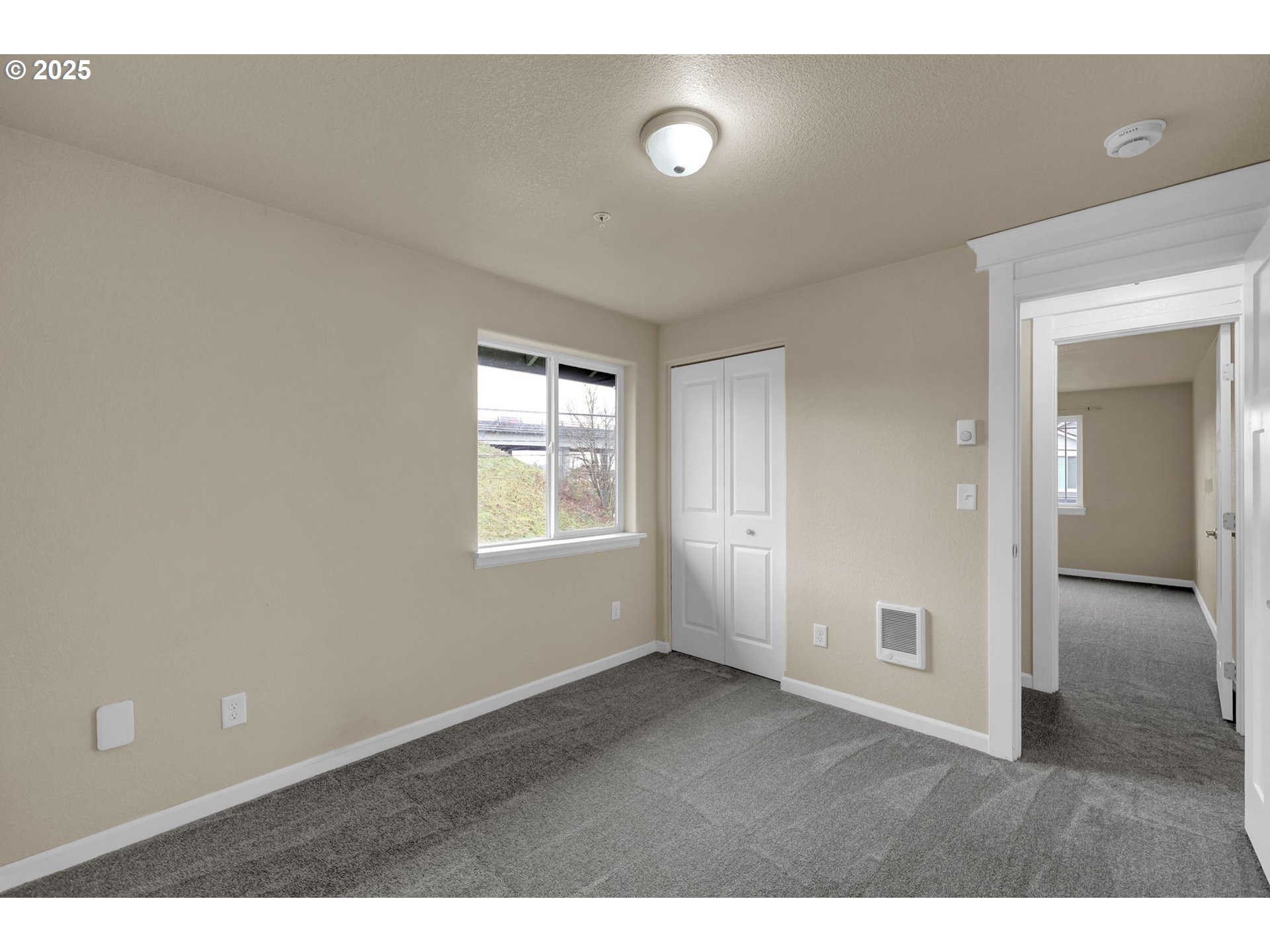 1725 Allea Drive Eugene, OR 97404 - Photo 30 of 44 view of an empty room with closet and a window
