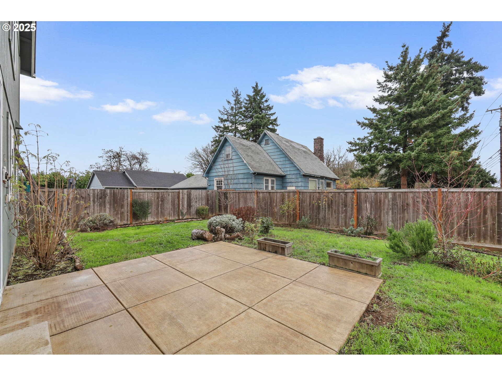 1725 Allea Drive Eugene, OR 97404 - Photo 34 of 44 a view of a backyard with wooden fence