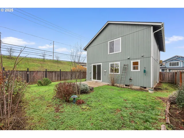 a view of a backyard of the house