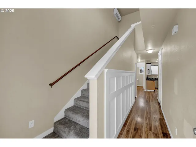 a view of entryway with wooden floor