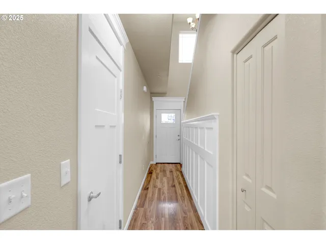 a view of a livingroom from a hallway