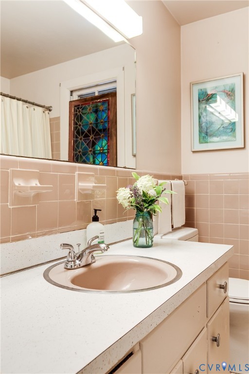 10475 Cherokee Road Richmond, VA 23235 - Photo 37 of 74 Bathroom vanity featuring a speckled white counter