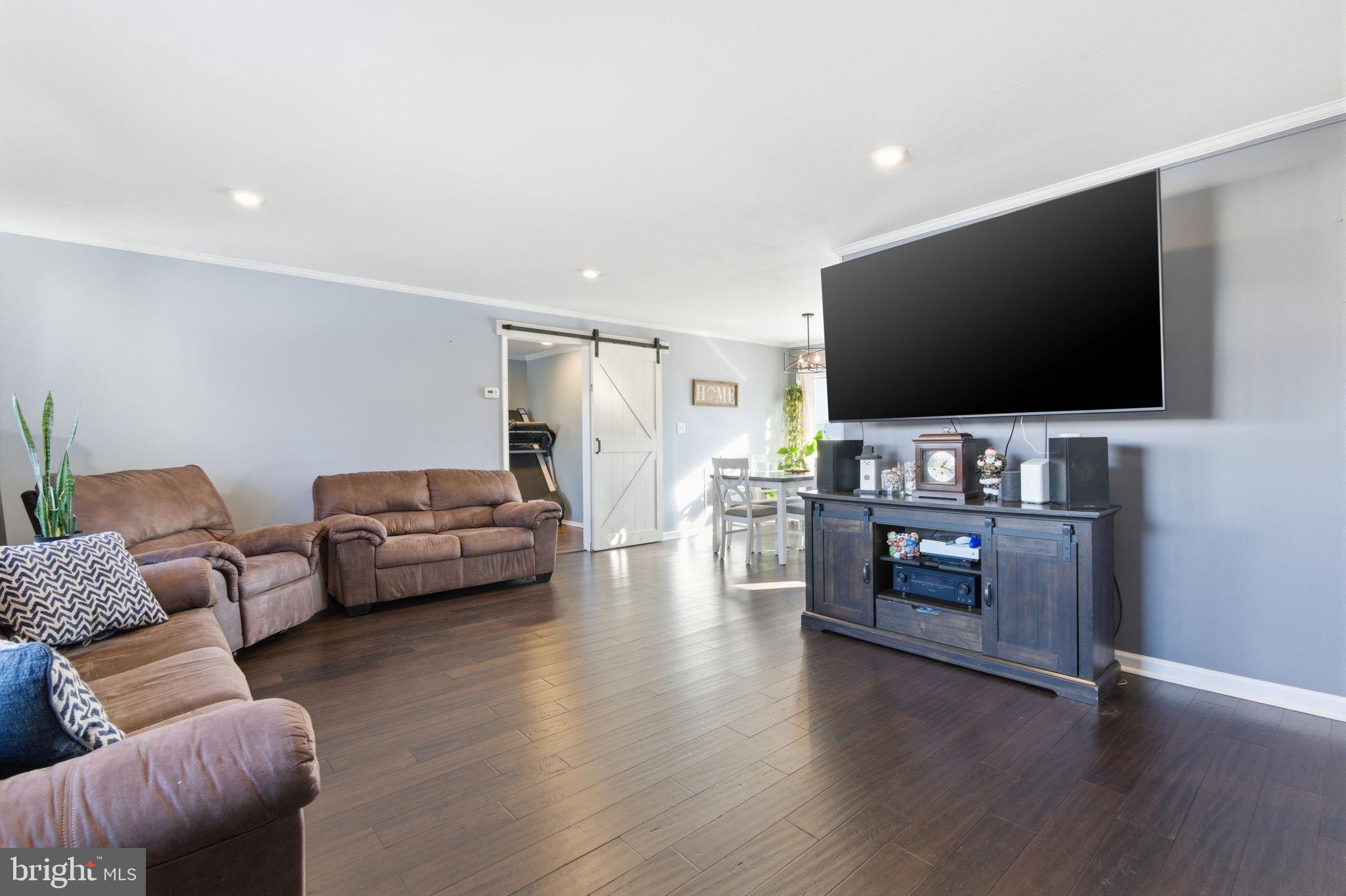 44 Cactus Road Levittown, PA 19057 - Photo 3 of 29 a living room with furniture and a flat screen tv