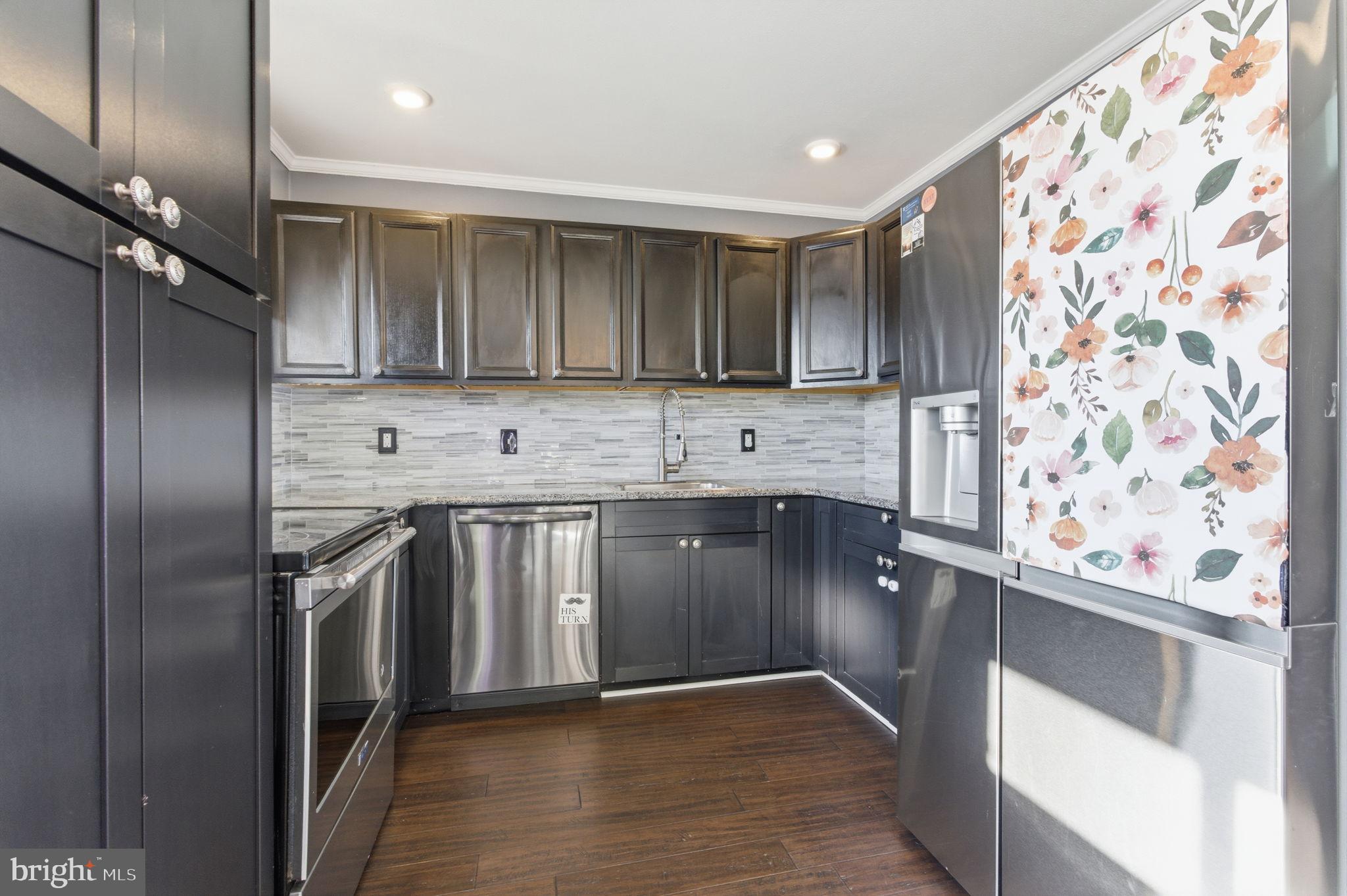 44 Cactus Road Levittown, PA 19057 - Photo 6 of 29 a kitchen with stainless steel appliances granite countertop a stove a sink and a refrigerator