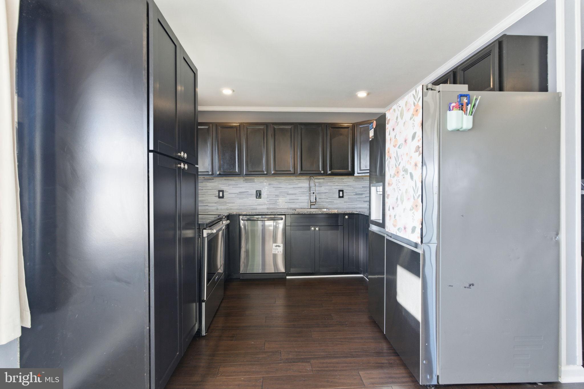 44 Cactus Road Levittown, PA 19057 - Photo 8 of 29 a kitchen with stainless steel appliances granite countertop a refrigerator and a sink