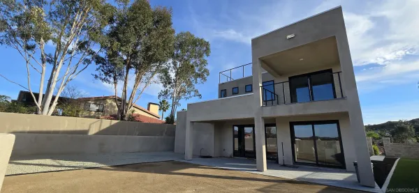 a view of a house with a tree