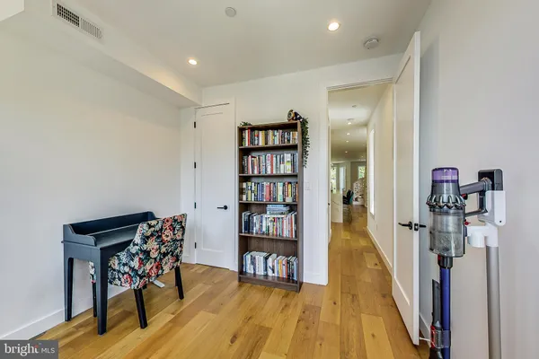 a livingroom with furniture and wooden floor
