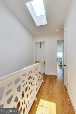 a view of hallway with wooden floor