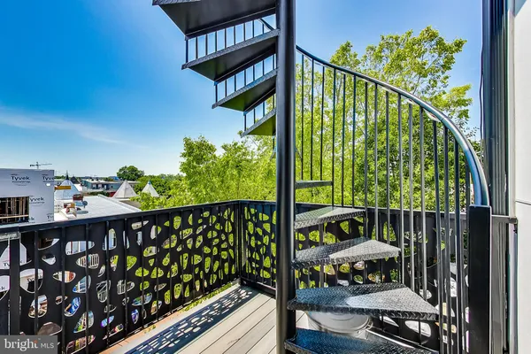 a view of a balcony with wooden floor