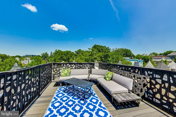 a balcony with furniture and city view