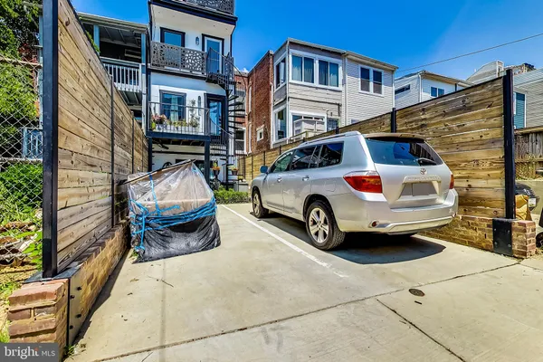 a car parked in front of a house