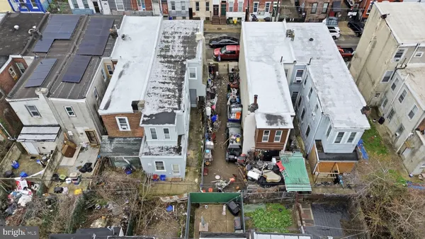 an aerial view of multi story residential apartment building with yard