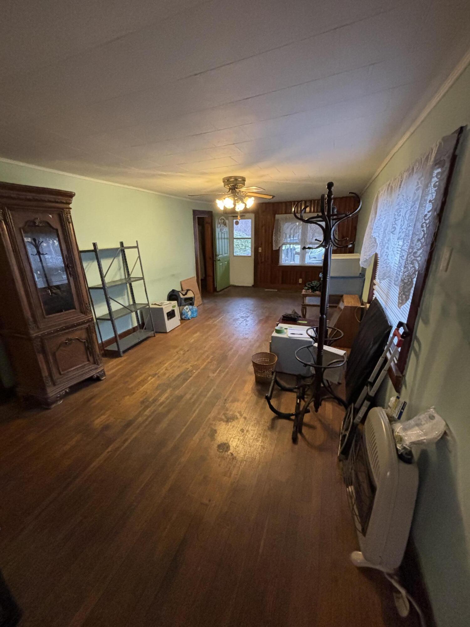 876 Dillon Street Pulaski, VA 24301 - Photo 13 of 18 a living room with furniture and a flat screen tv