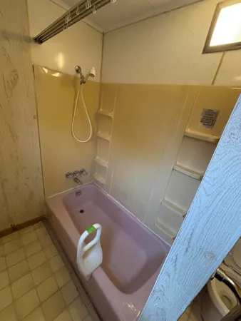 a bathroom with a sink toilet and mirror