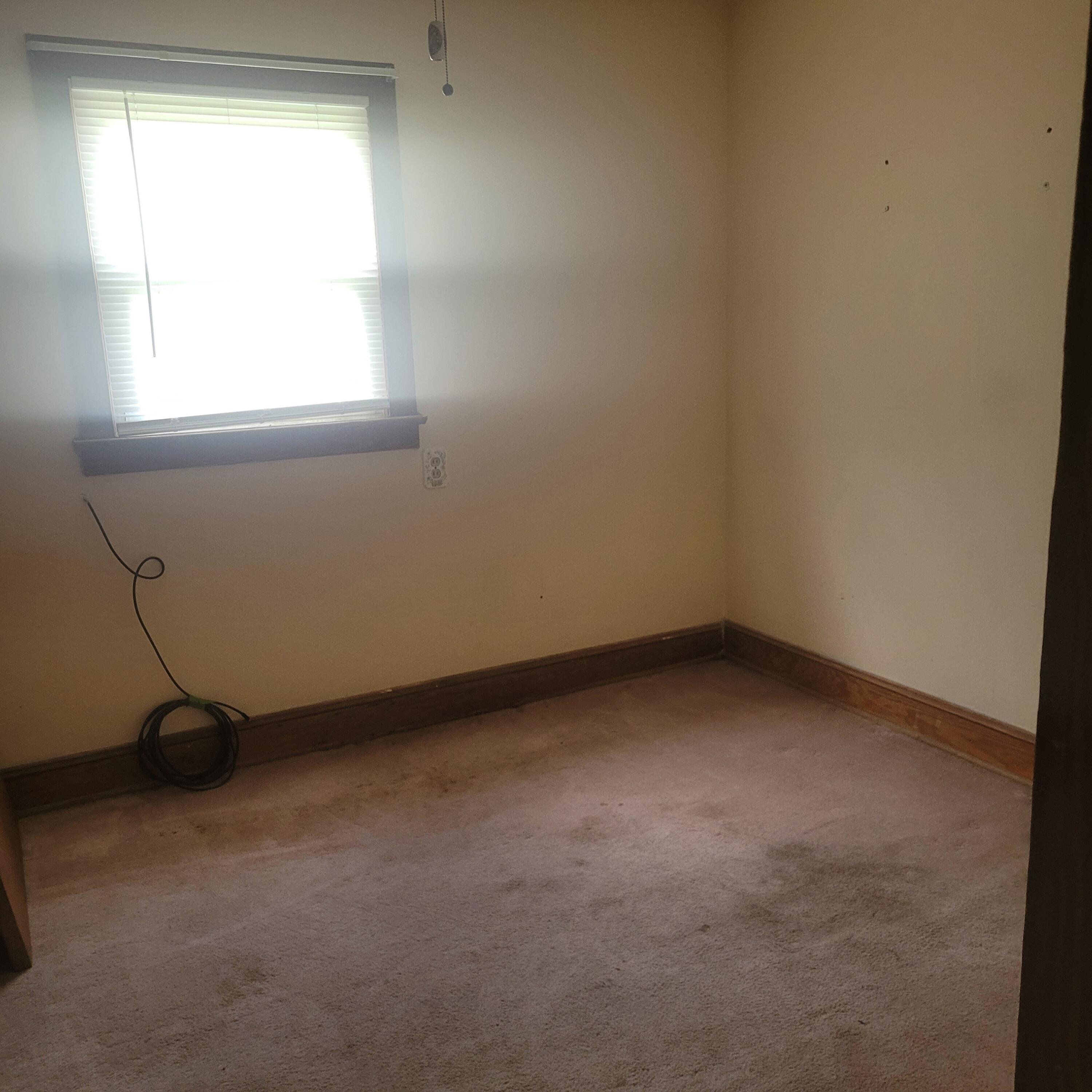 876 Dillon Street Pulaski, VA 24301 - Photo 9 of 18 an empty room with a window