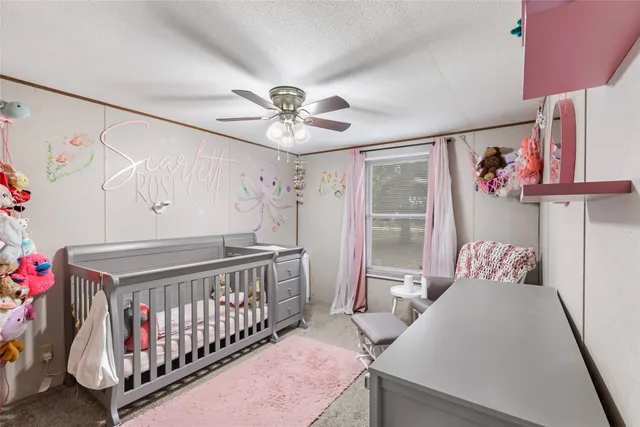 a bedroom with furniture and a window