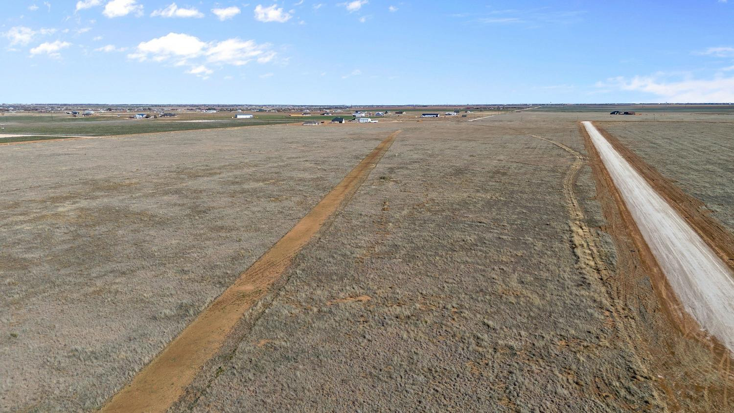 6883 Brody Road Lubbock, TX 79407 - Photo 7 of 9 a view of an empty room and mountain view