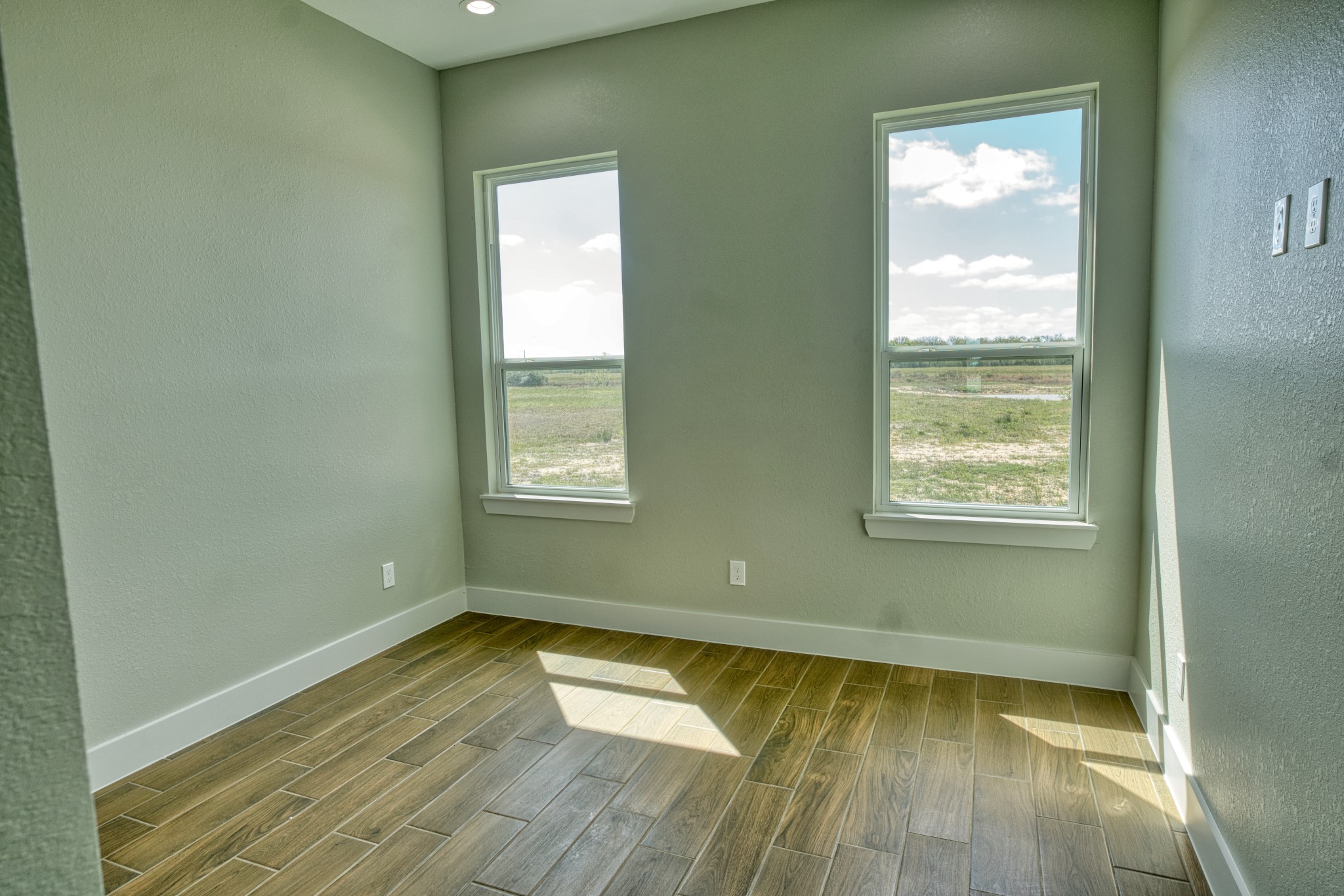925 Buffalo Trail Angleton, TX 77515 - Photo 36 of 45 a view of a room with wooden floor and windows