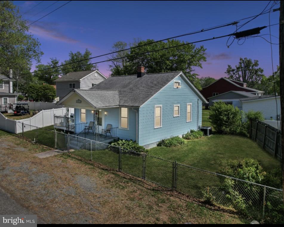 312 Vernon Street Colonial Beach, VA 22443 - Photo 1 of 45 a front view of a house with a yard